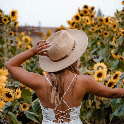 Woman In Sunflower Field